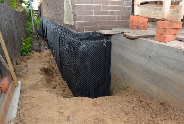 Happy homeowners after waterproofing job in Pleasant Lake